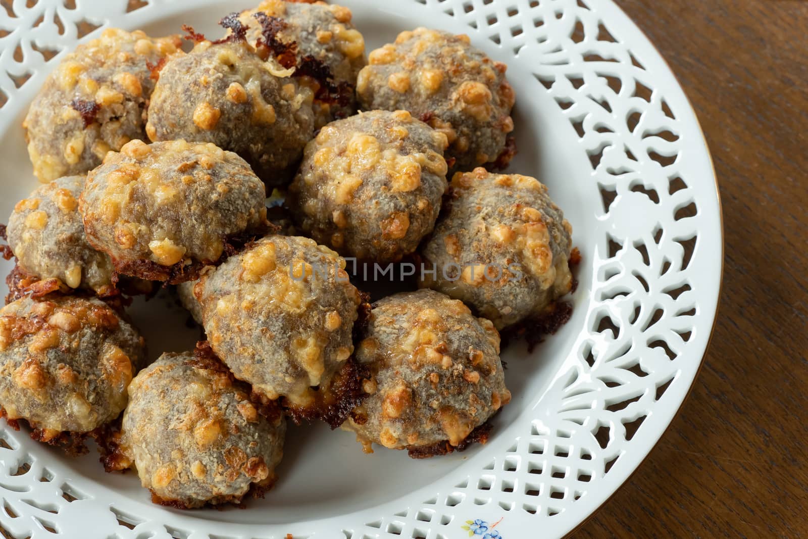 Homemade food, meat balls with cheese.