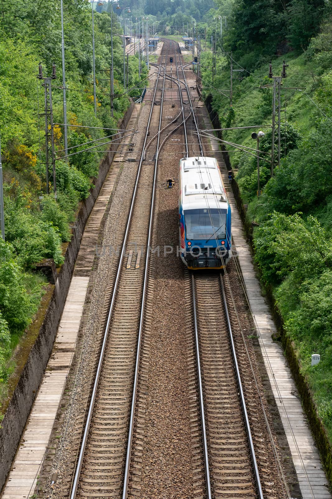 View on two railway track lines and train by xtrekx