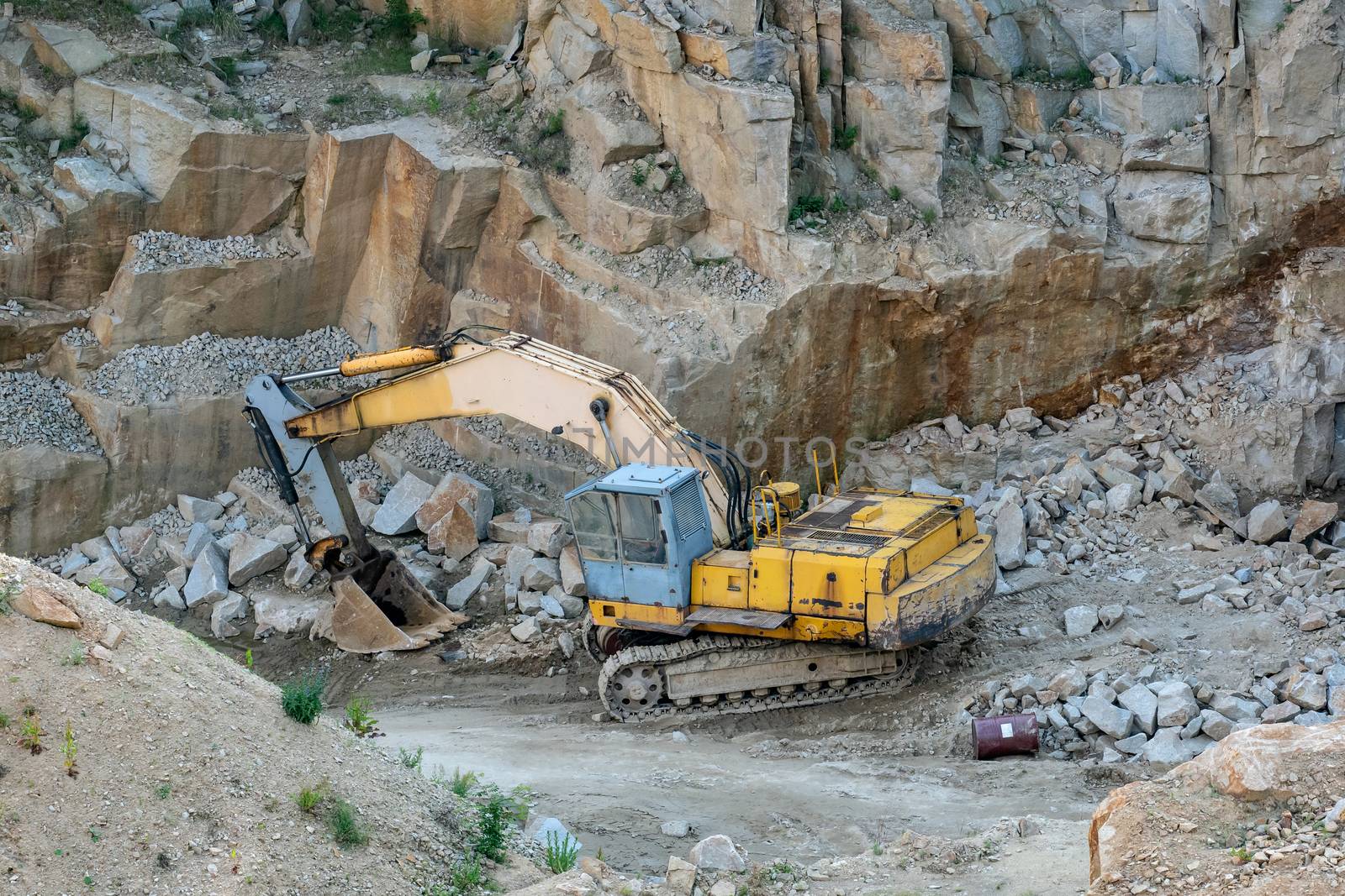 Mining in the granite quarry. Working mining machine - old digge by xtrekx