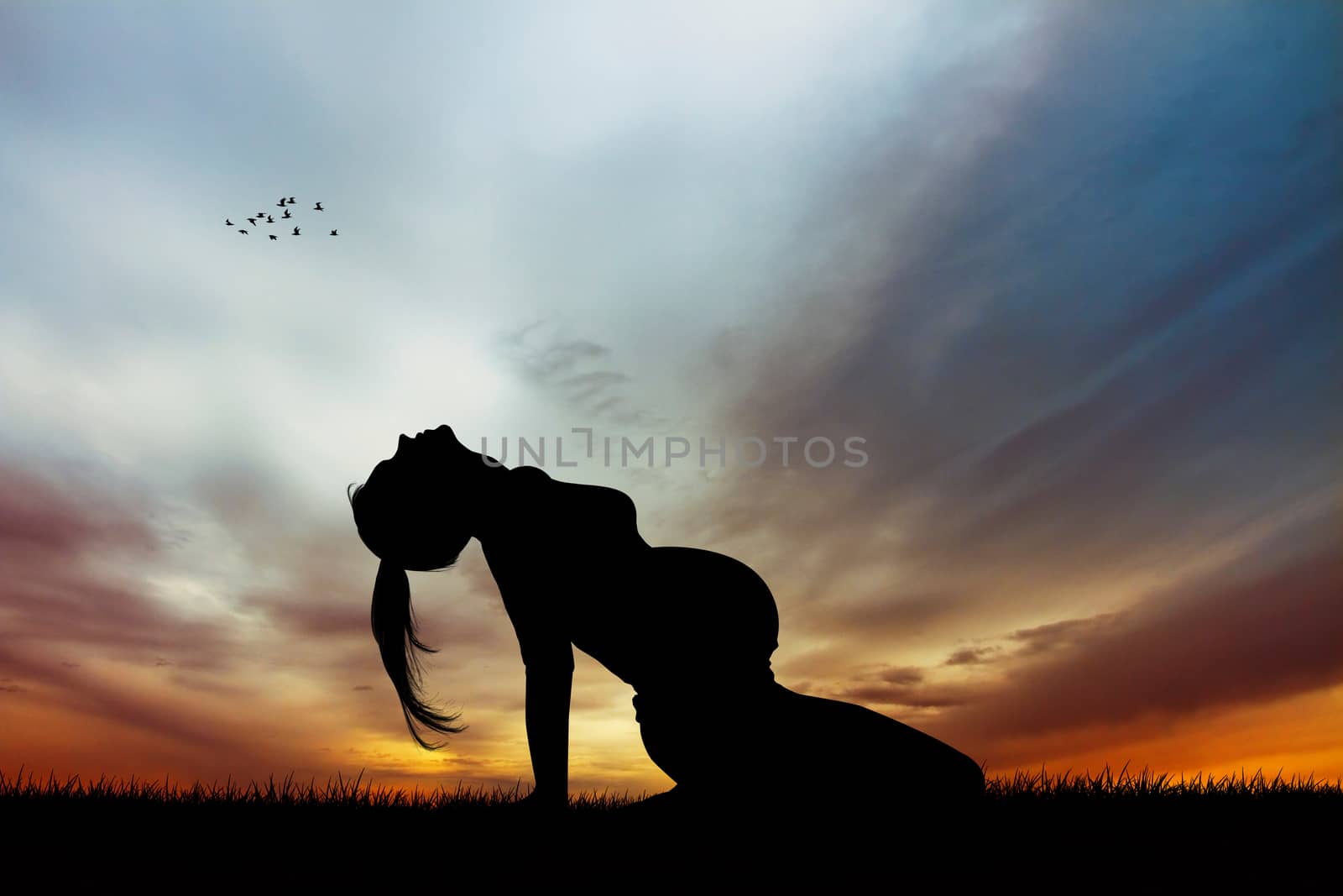 a pregnant girl doing yog at sunset by adrenalina