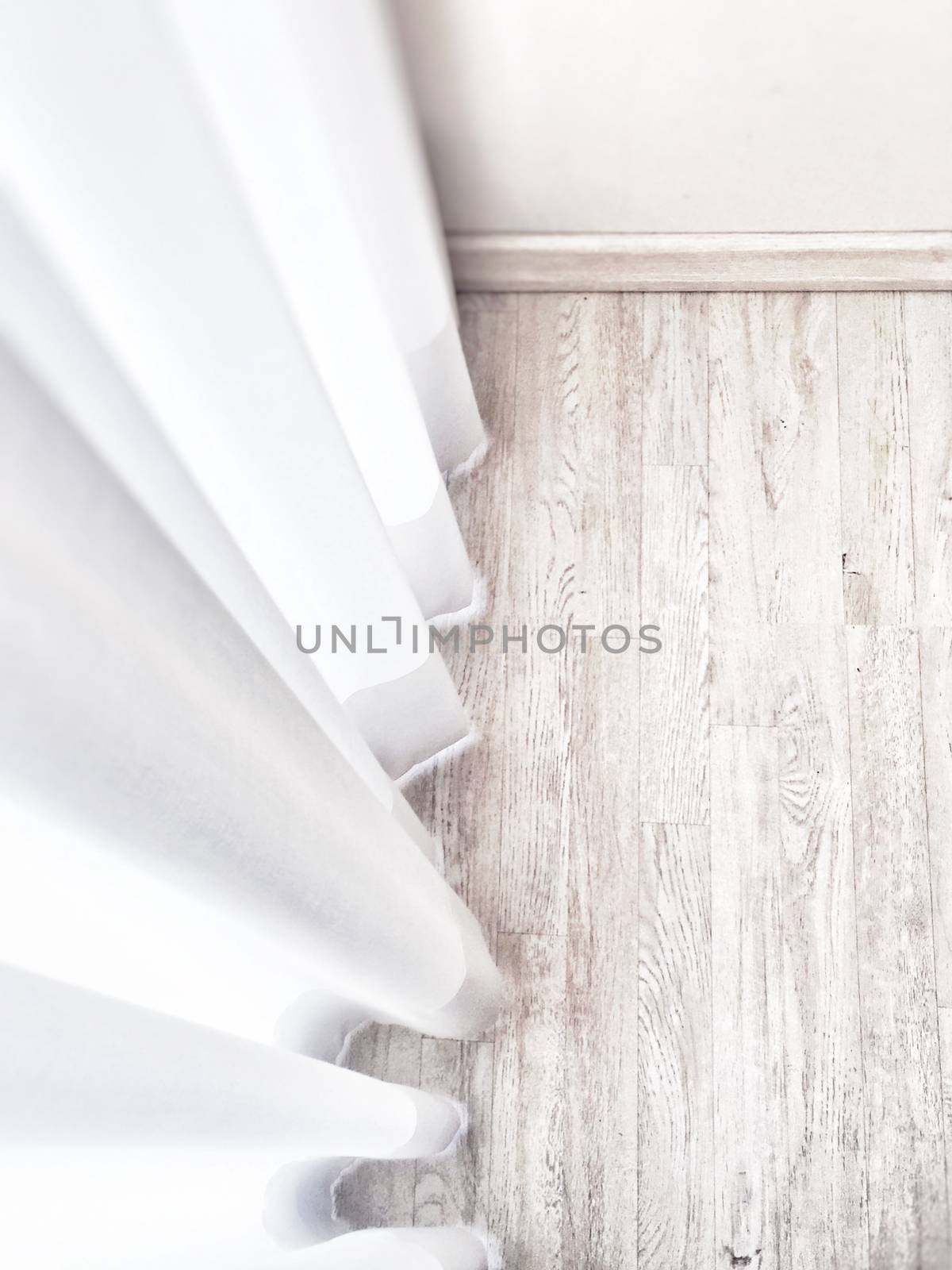Wooden parquet floor with white curtains. Interior design detail
