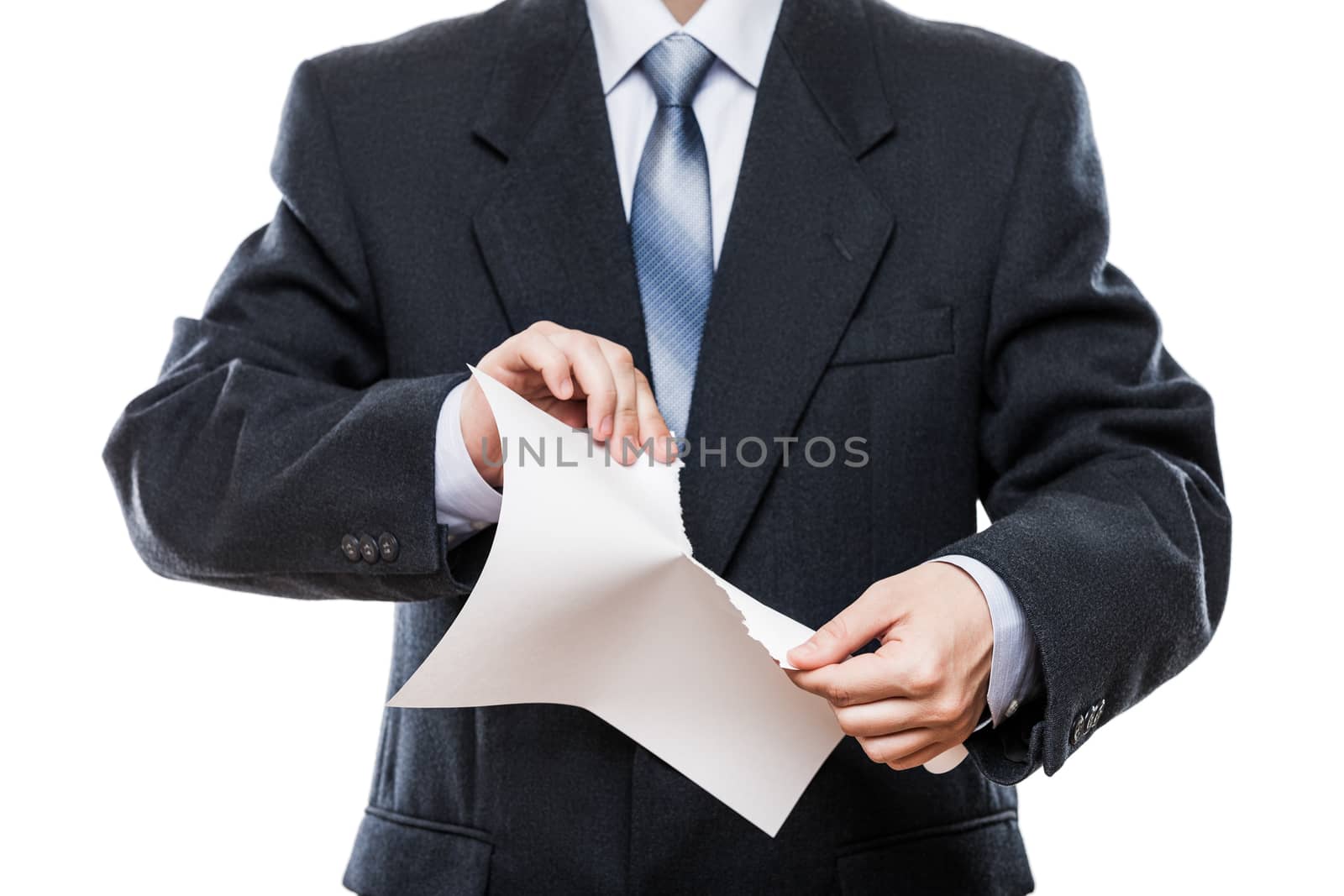 Angry businessman hand tearing paper document by ia_64