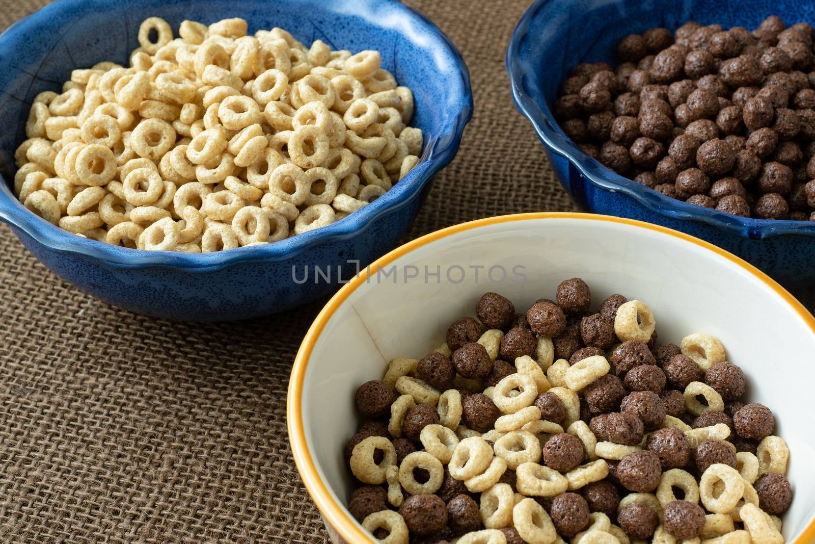Set of various cereal bowl for breakfast. Corn rings with chocolate and cereal.