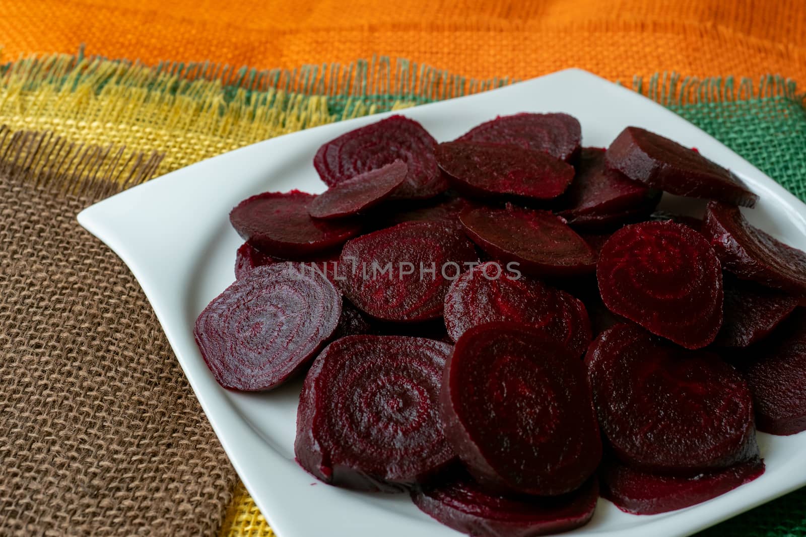 Beetroot (beet) chopped for salad in plate. Healthy ingredient for cooking. Cooked beet.