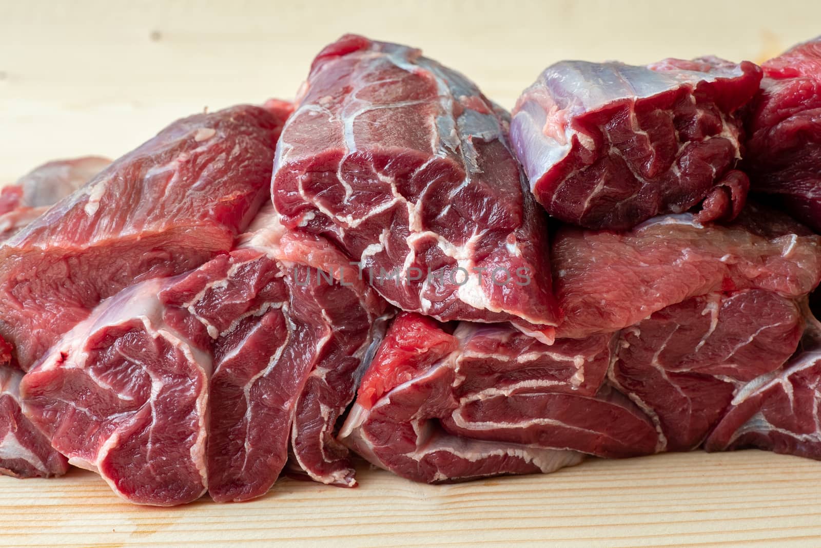 Raw breef meat on wooden table