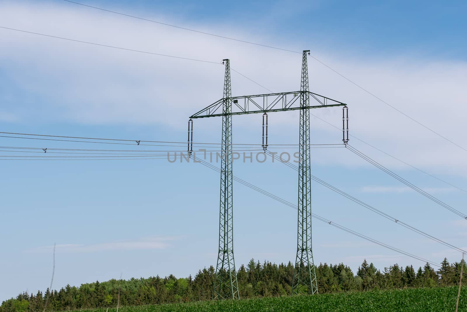 High voltage power lines with blue sky