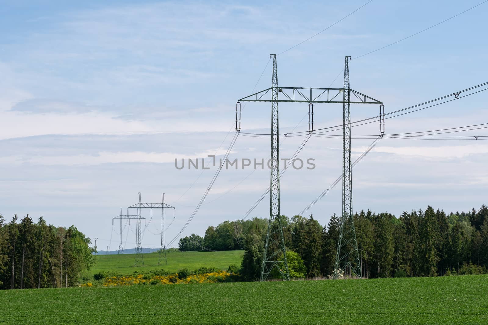 High voltage power lines with blue sky