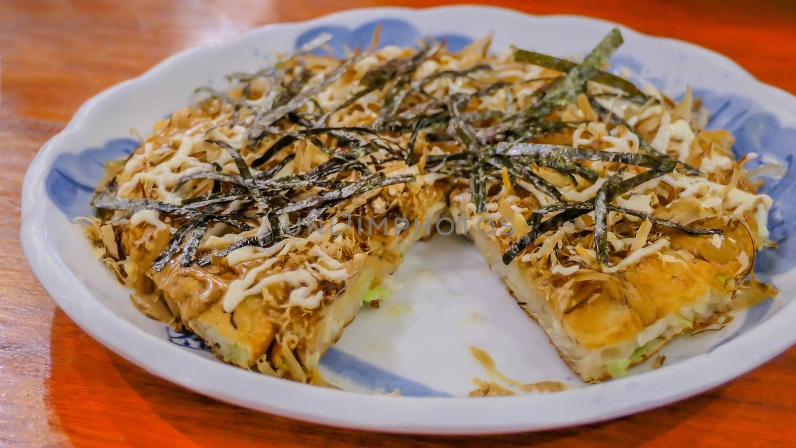 seafood Okonomiyaki pizza , Japanese-style pancakes on dish , selective focus