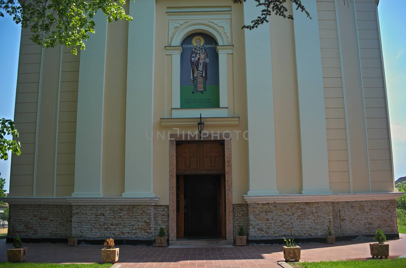 Front with entrance in Church in Kac, Serbia by sheriffkule