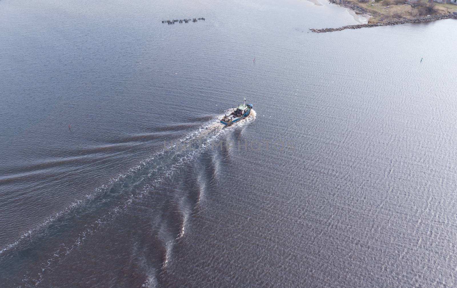 ship going in to Harbor Roja Latvia Aerial view of countryside drone top view