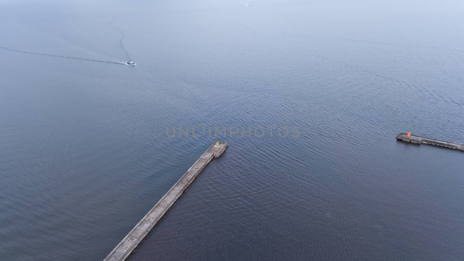 ship going in to Harbor Roja Latvia Aerial view of countryside drone top view by desant7474