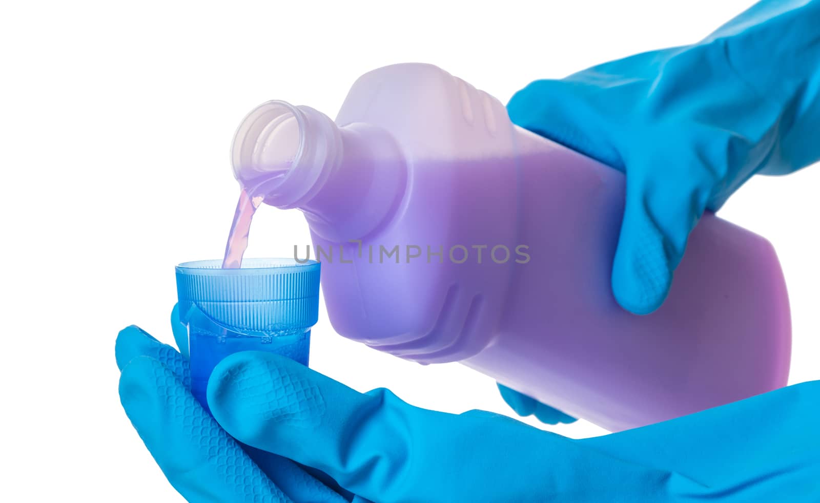 hands in gloves pour a detergent on white isolated background