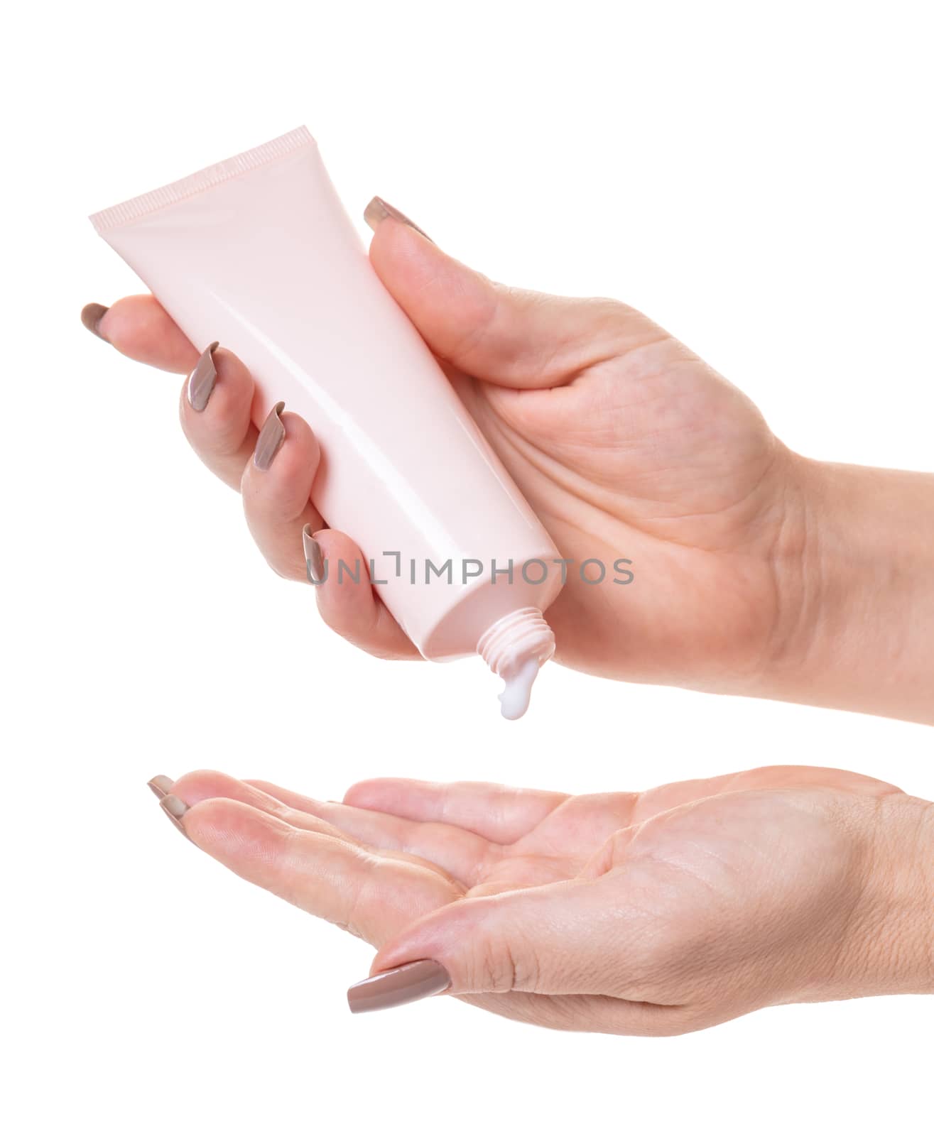 Female hands with a tube of cosmetic cream on white isolated background