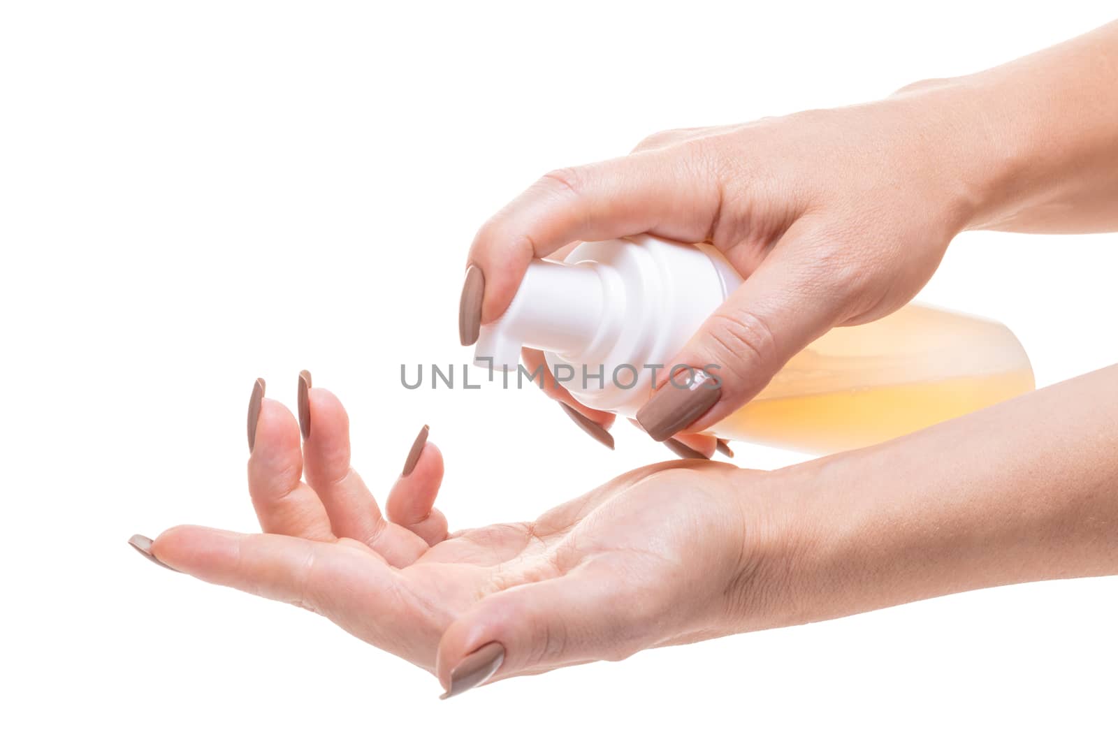 cosmetic lotion in female hands on white isolated background