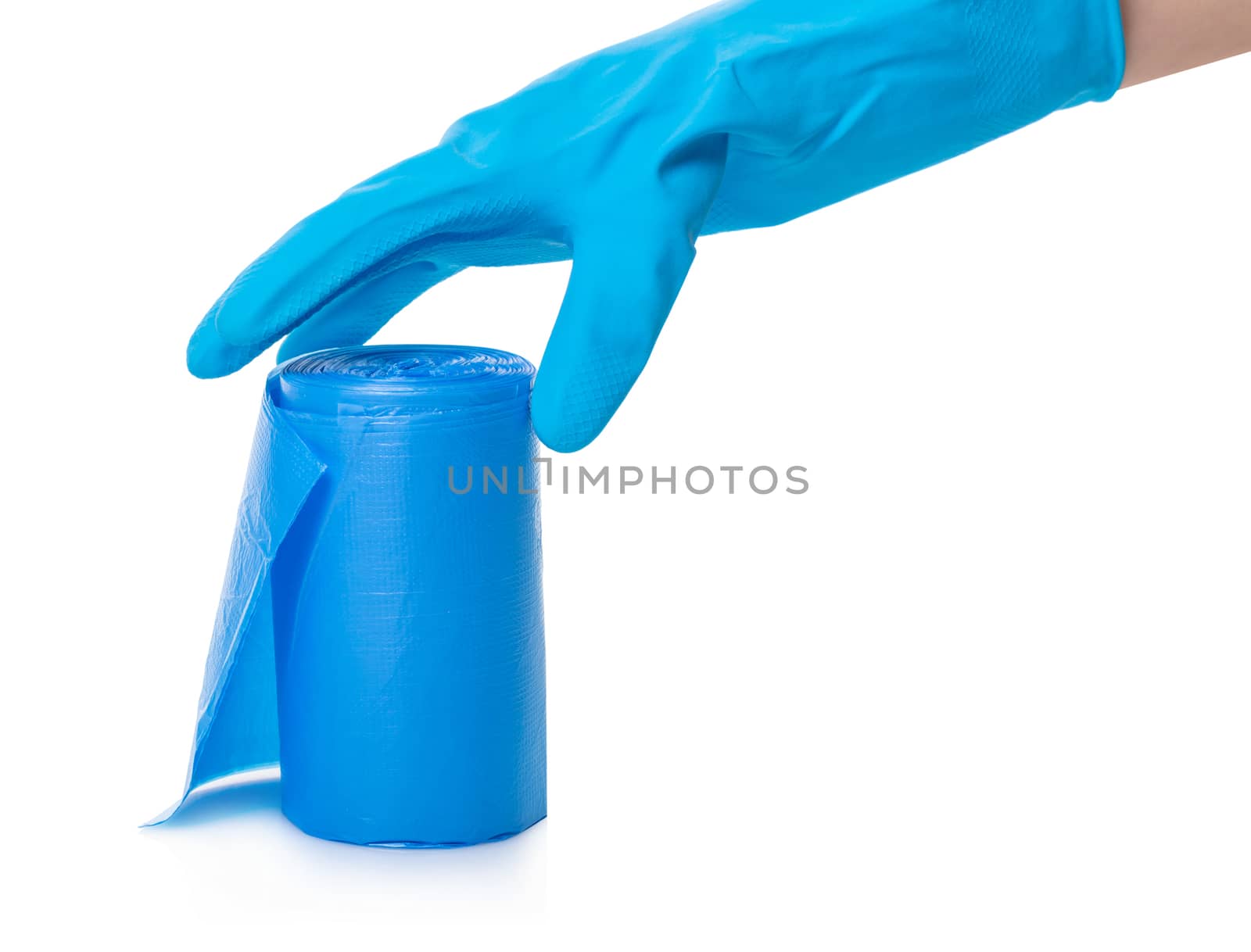 roll of garbage bags in a hand on a white isolated background