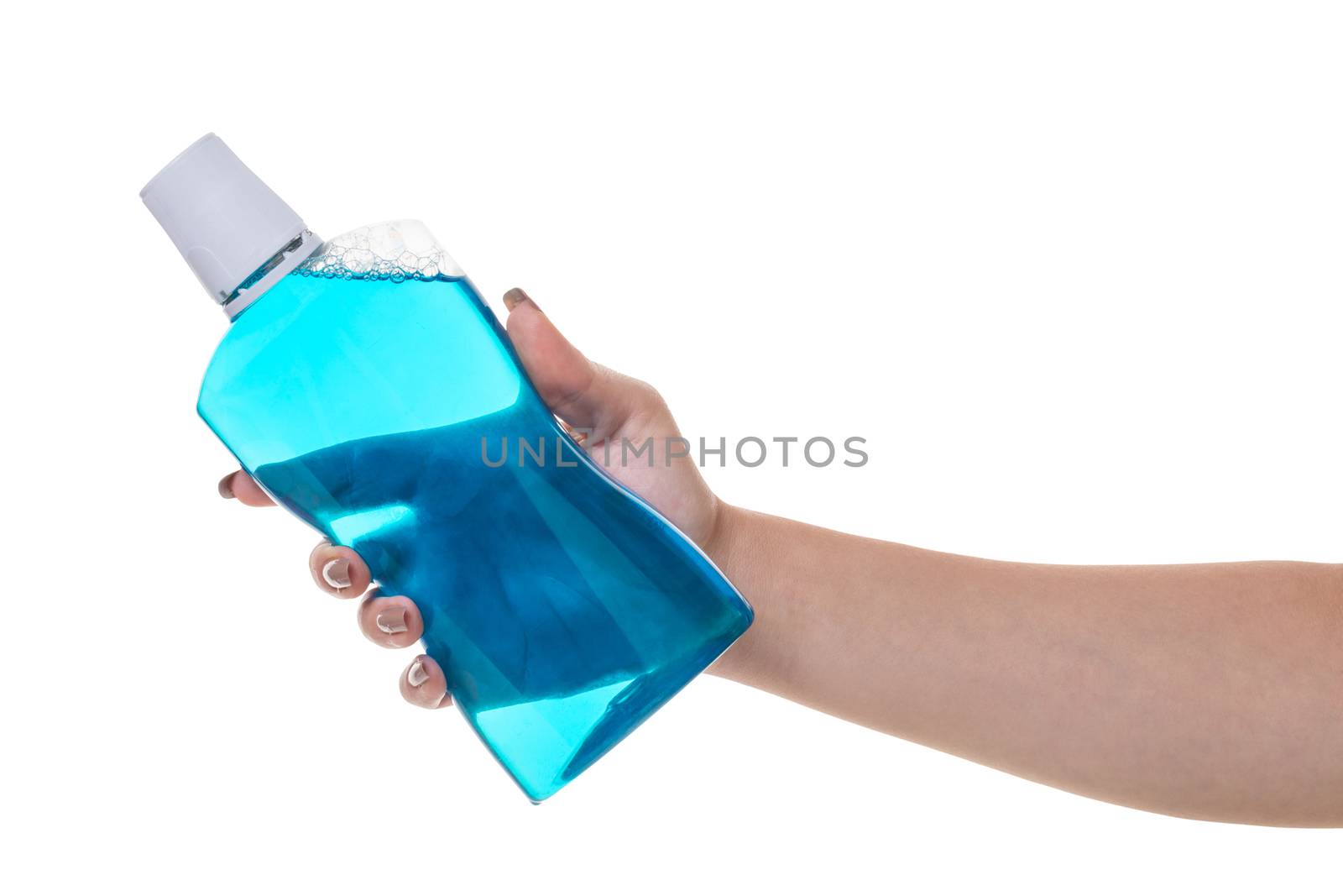 bottle with rinse aid for mouth in hand on white isolated background