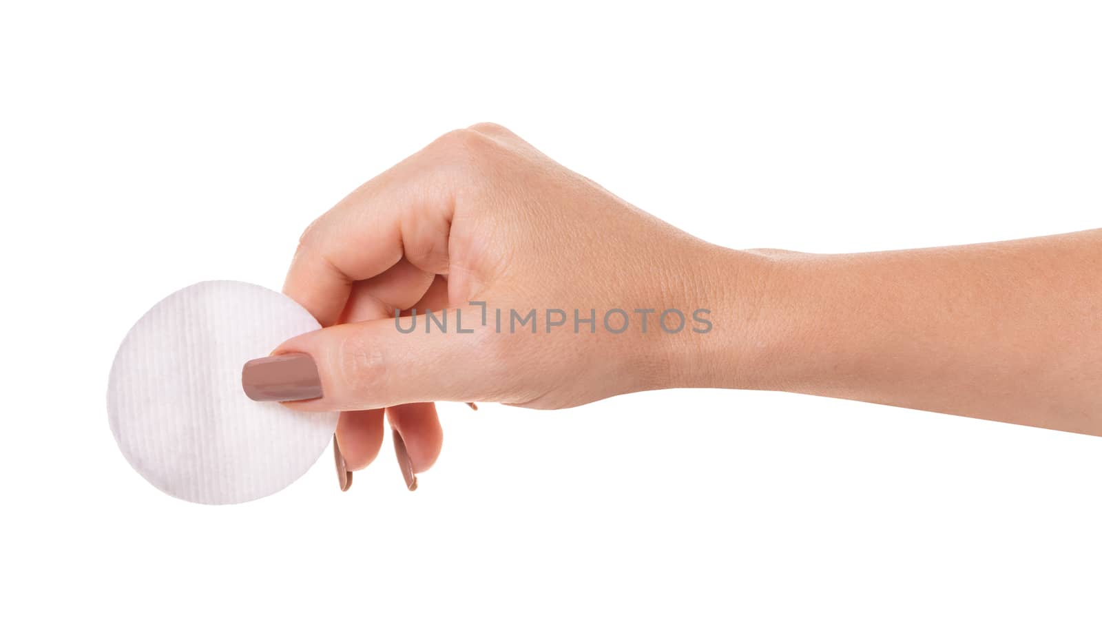 wadded disk in a female hand on white isolated background
