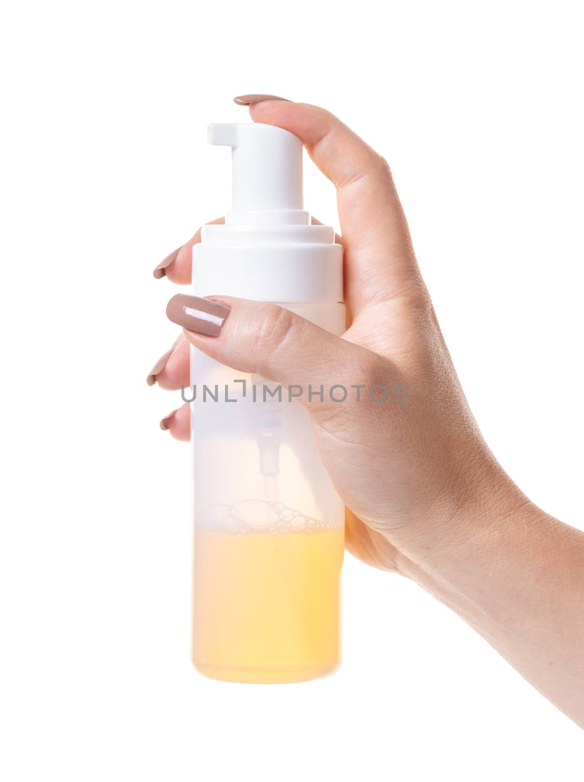 cosmetic lotion in female hand on white isolated background