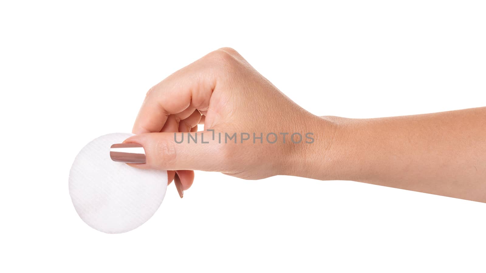 wadded disk in a female hand on white isolated background