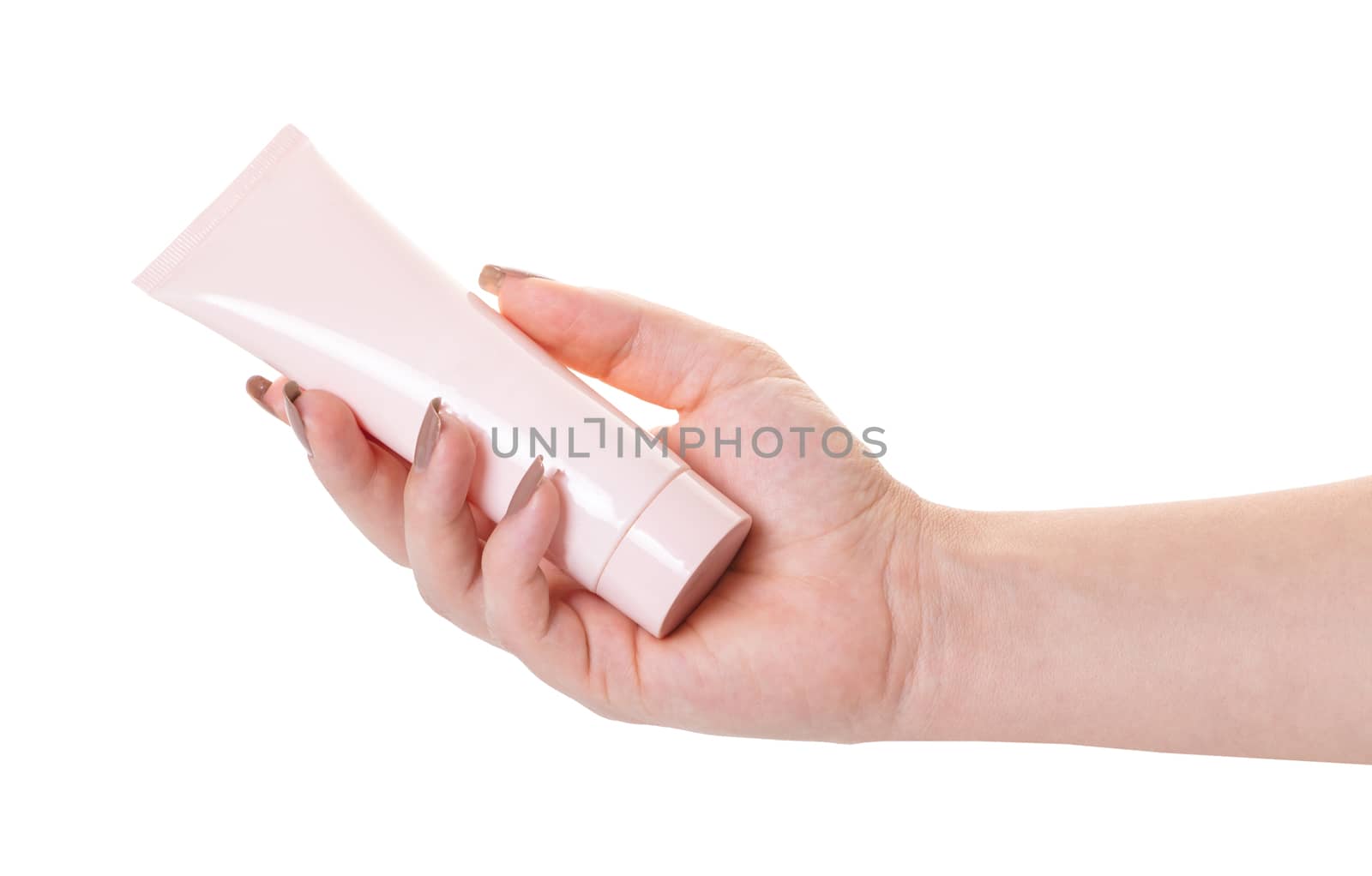 Female hand with a tube of cosmetic cream on white isolated background