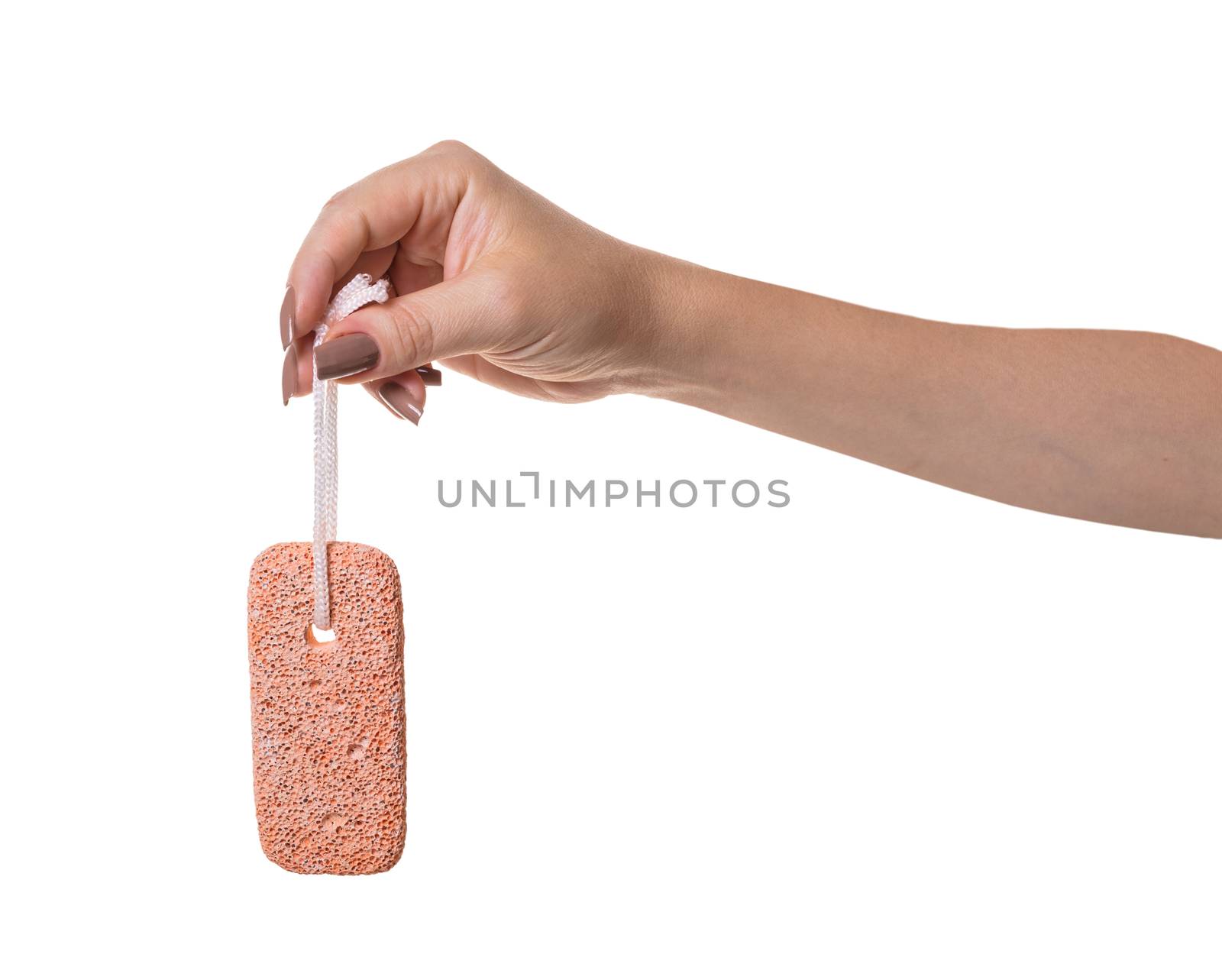 pumice stone in female hand on white isolated background