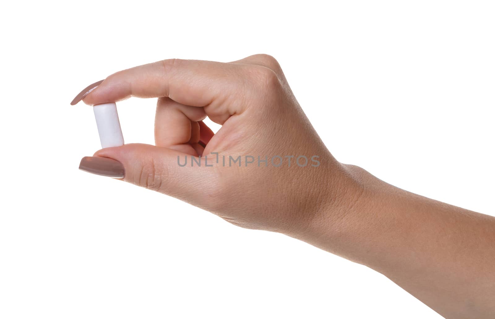 chewing gum in a female hand on white isolated background