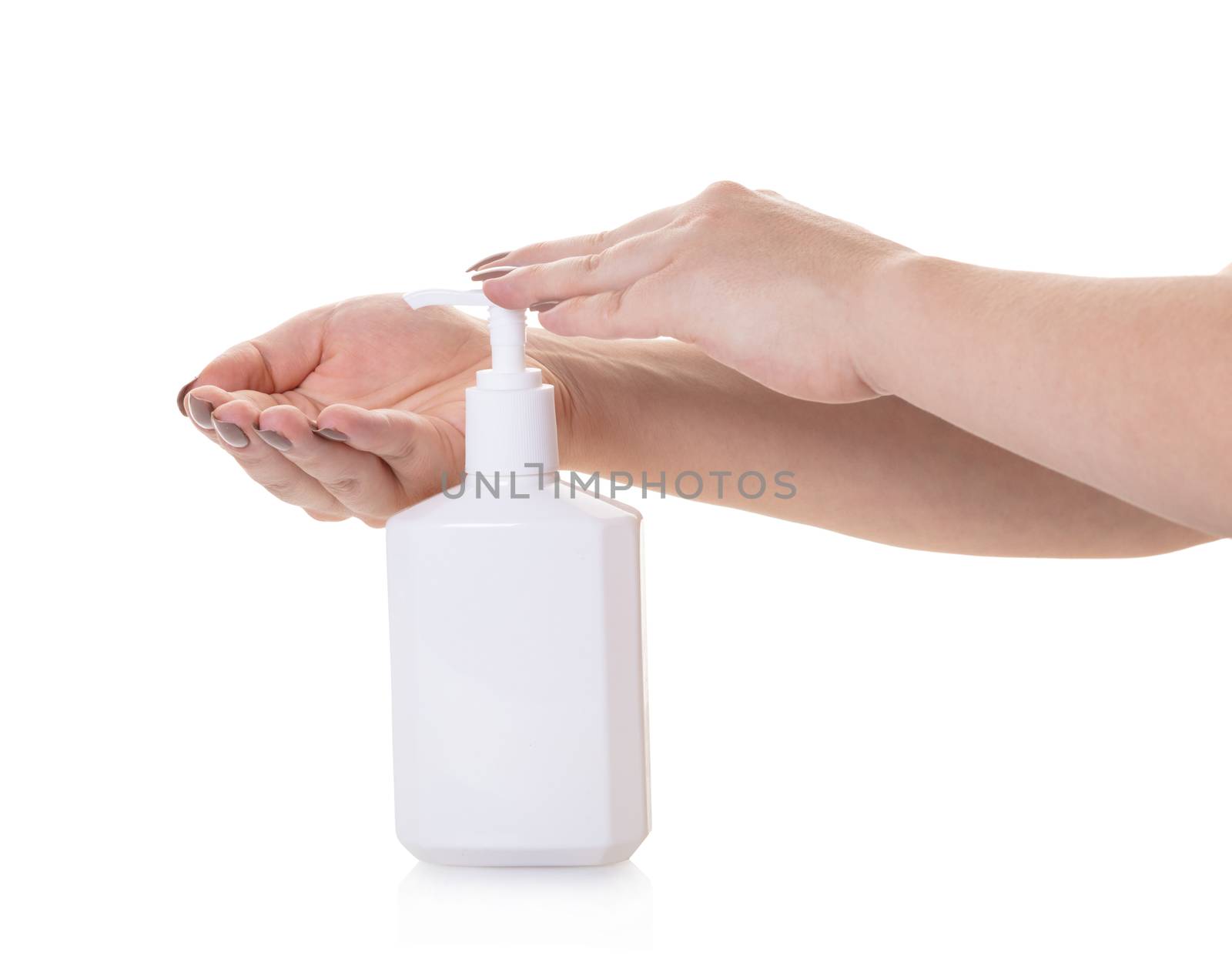 bottle with liquid soap in hand on white isolated background