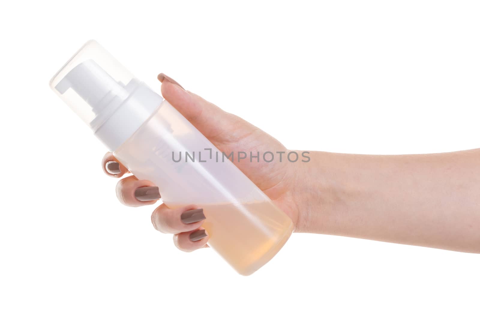 cosmetic lotion in female hand on white isolated background