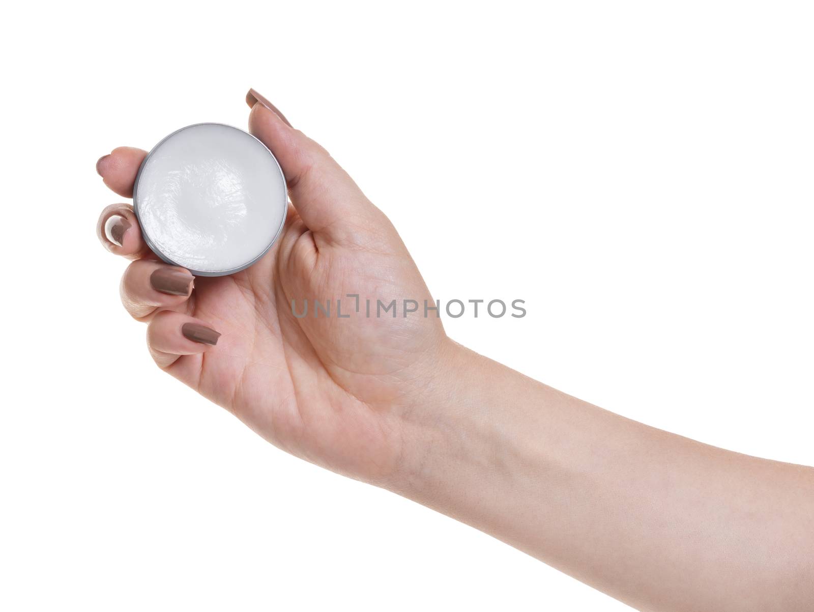 jar with lip cream in hand on white isolated background