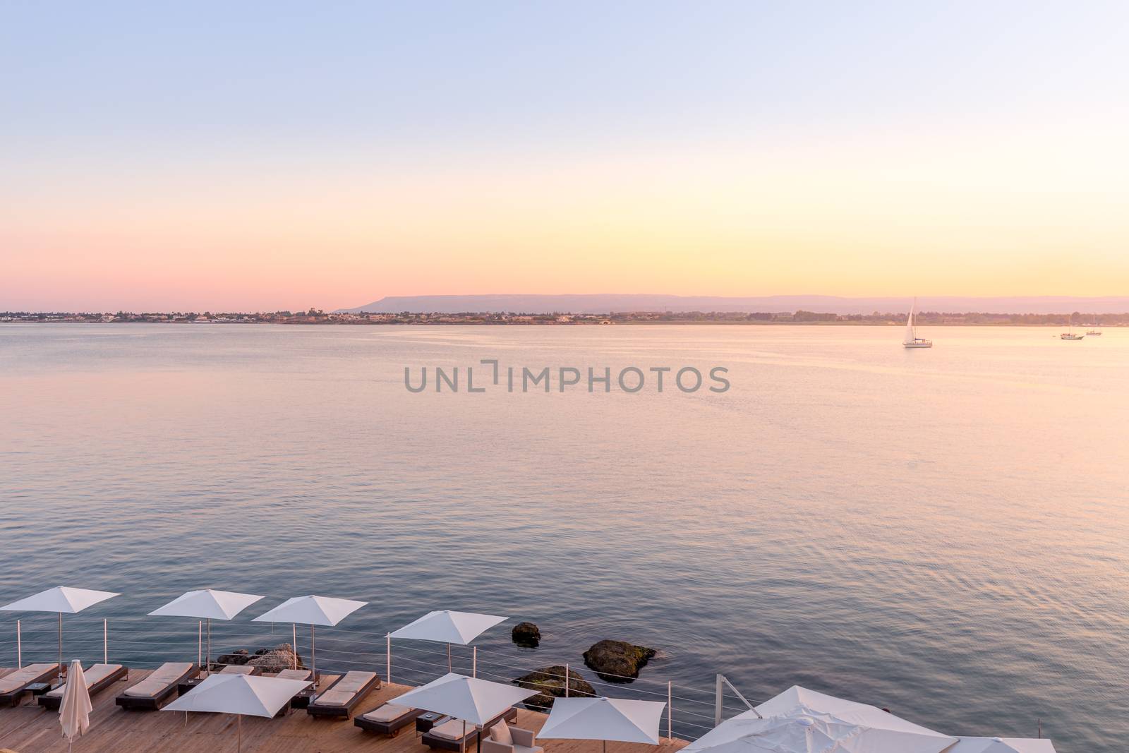 Syracuse, Isle of Sicily, Italy. Sunset in front of the sea at the end of a spring day in May.