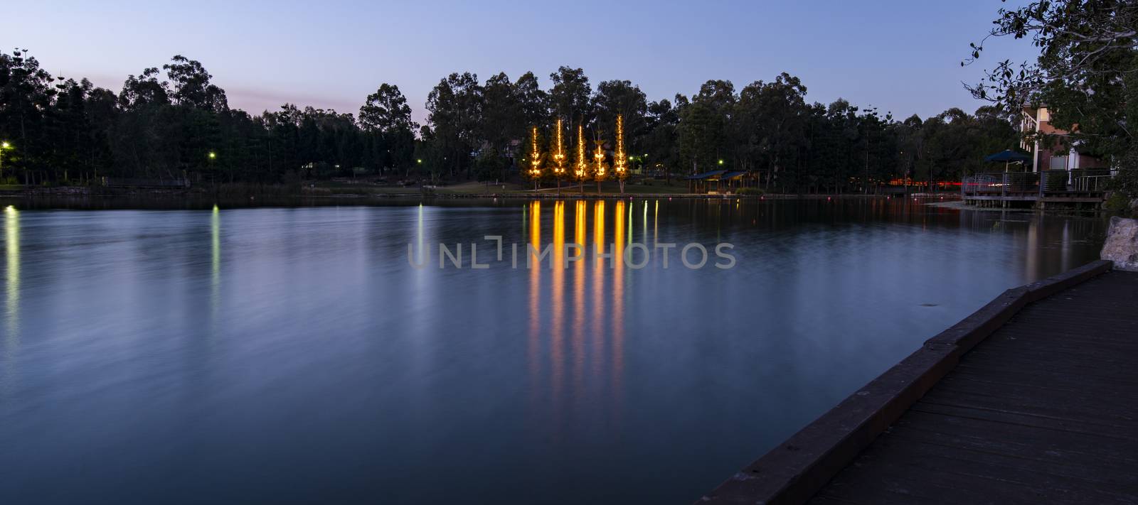 Beautiful lake in Springfield Lakes at dusk. by artistrobd
