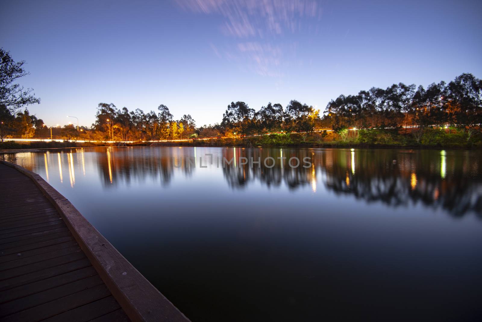 Beautiful lake in Springfield Lakes at dusk. by artistrobd