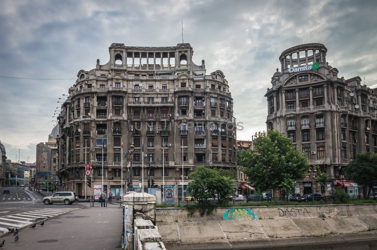 BUCHAREST, ROMANIA - 07.20.2018. Old Center of Bucharest, Romania in a cloudy summer morning. Sullen and unpleasant atmosphere, dirty streets and shabby buildings.