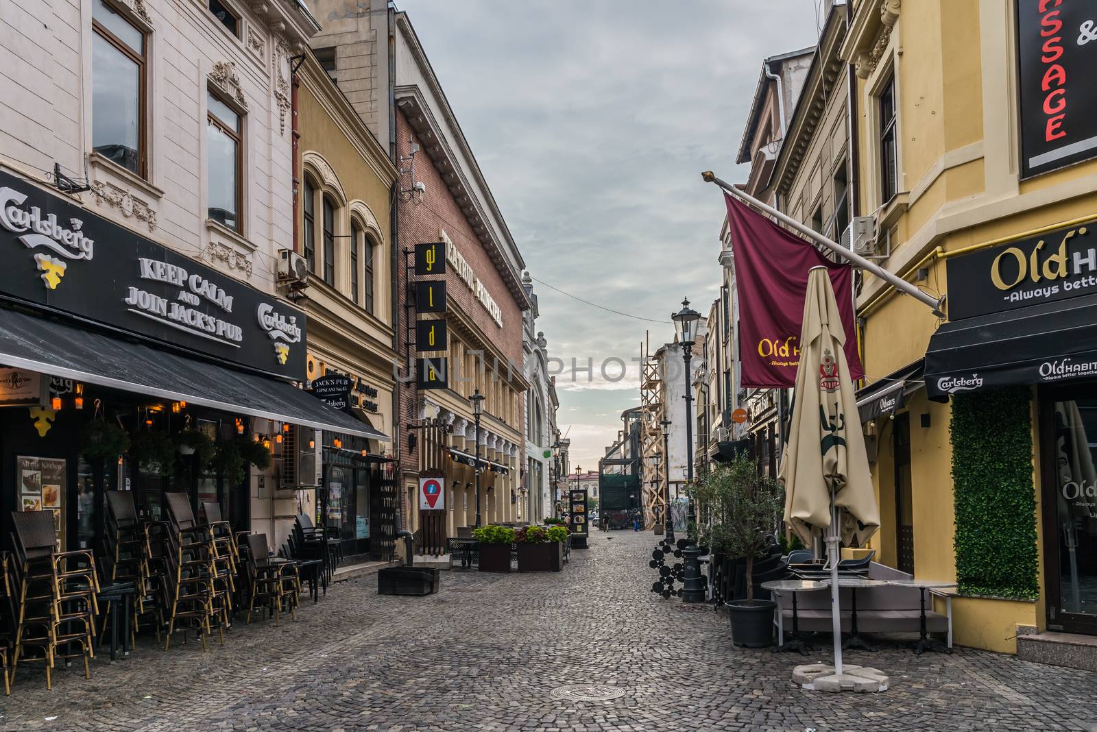 BUCHAREST, ROMANIA - 07.20.2018. Old Center of Bucharest, Romania in a cloudy summer morning. Sullen and unpleasant atmosphere, dirty streets and shabby buildings.