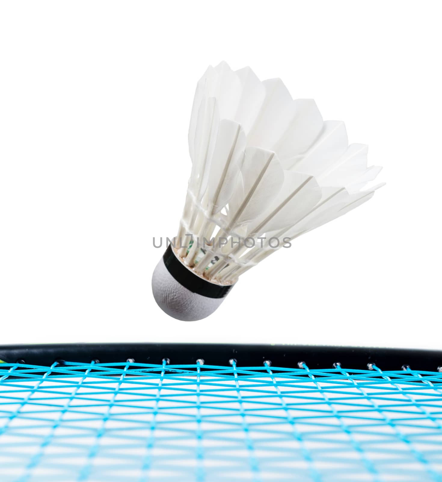 Close up shuttlecock and badminton racket on white background.