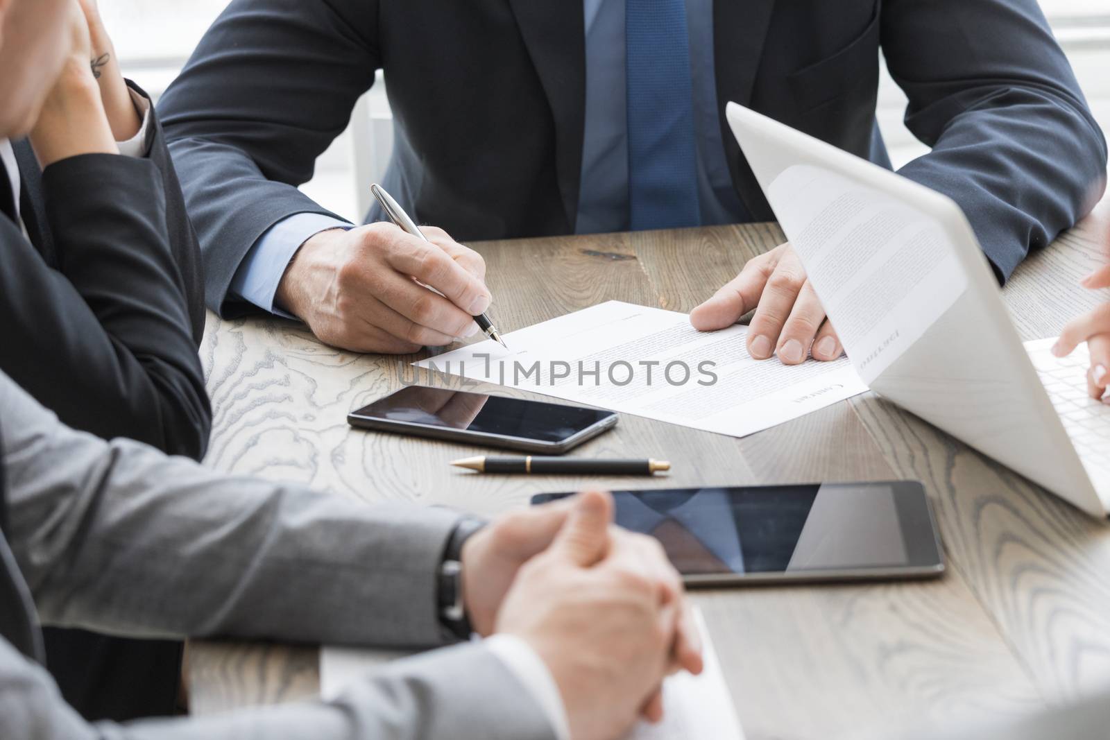 Business man sign contract on the desk at meeting