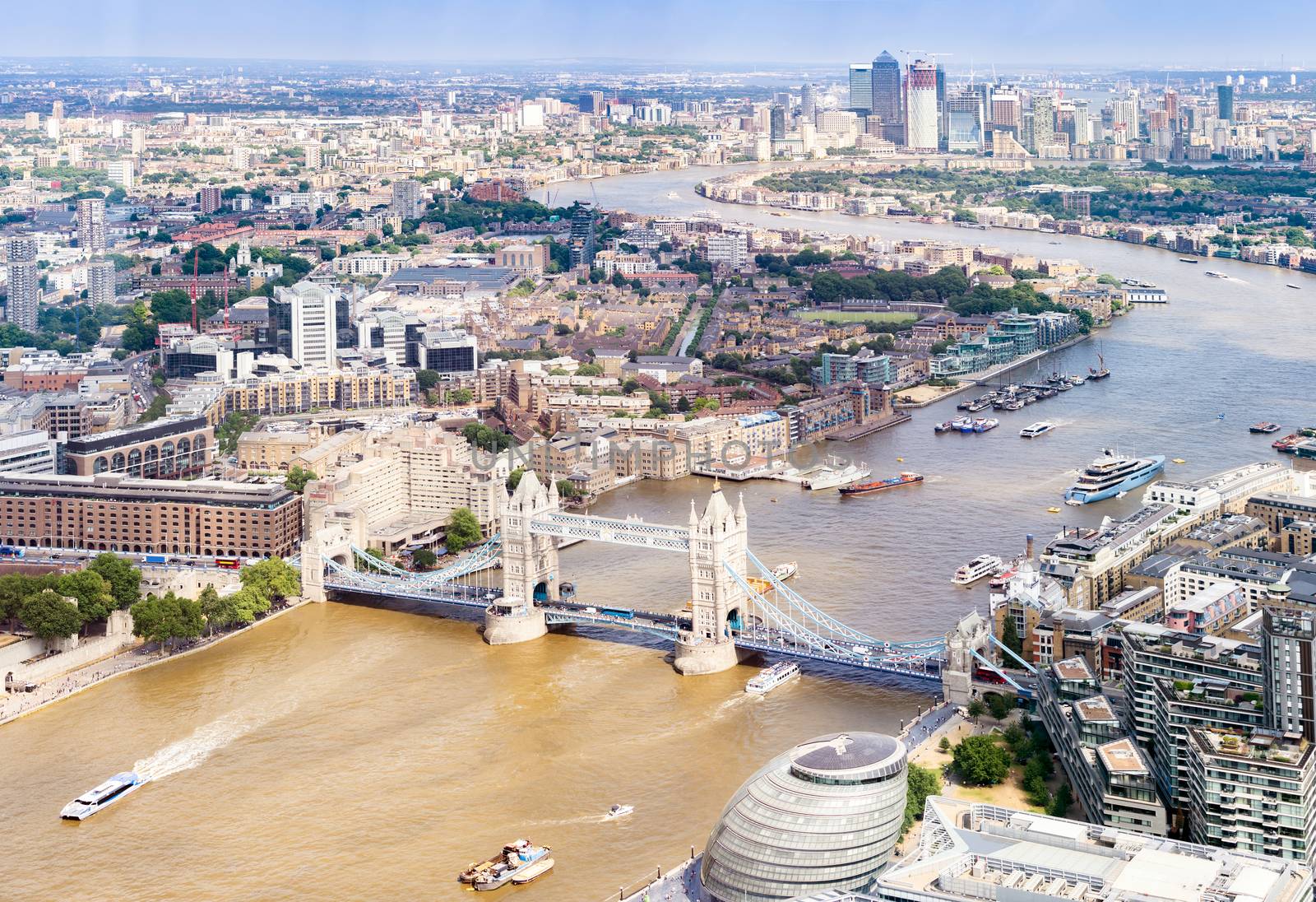 Aerial view of London Tower Bridge and Skyscraper in Canary Whraf, London UK.