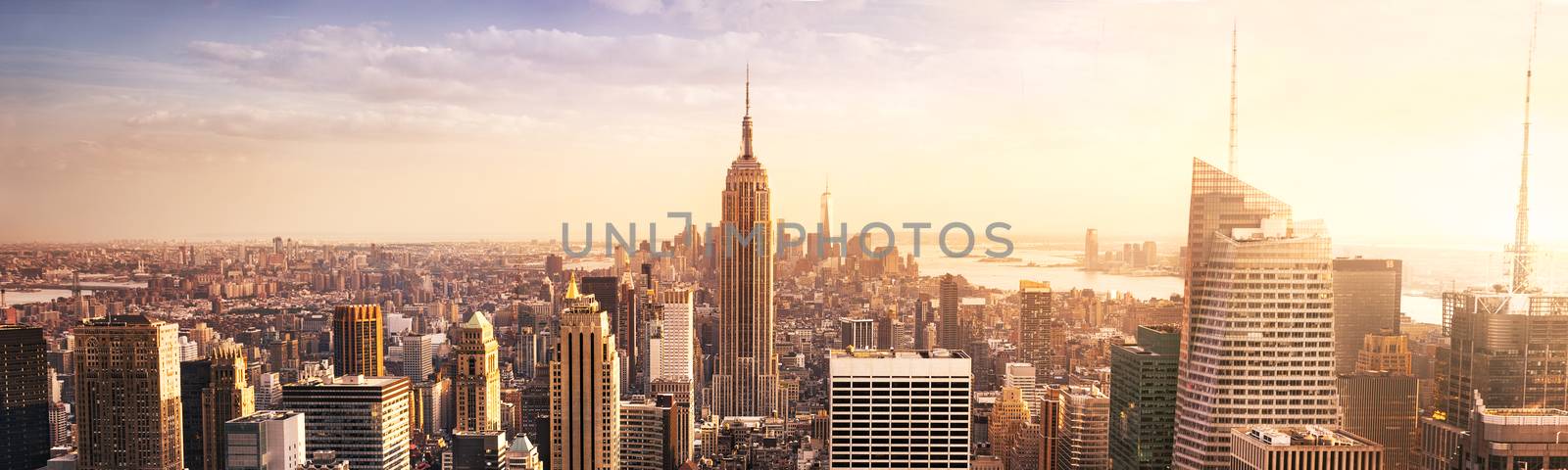 New York City skyline with urban skyscrapers at sunset, USA.