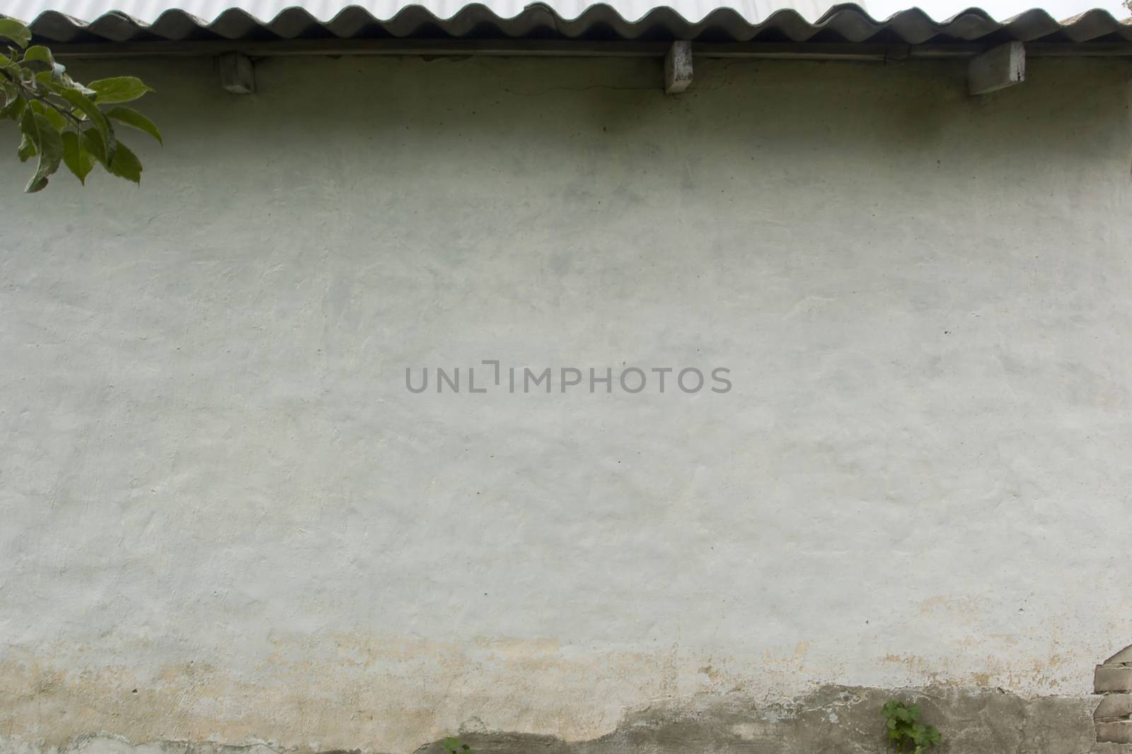 Wall of the rural house covered with plaster