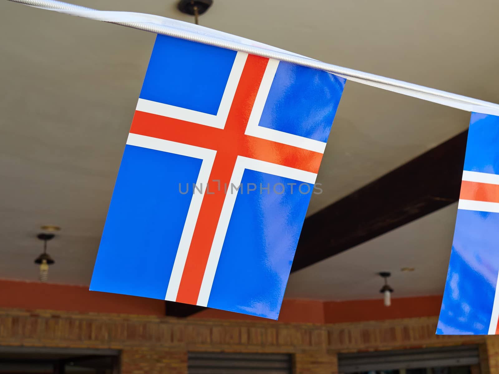 Iceland flag - flag of Iceland - Icelandic flag hanged on a line of flags     