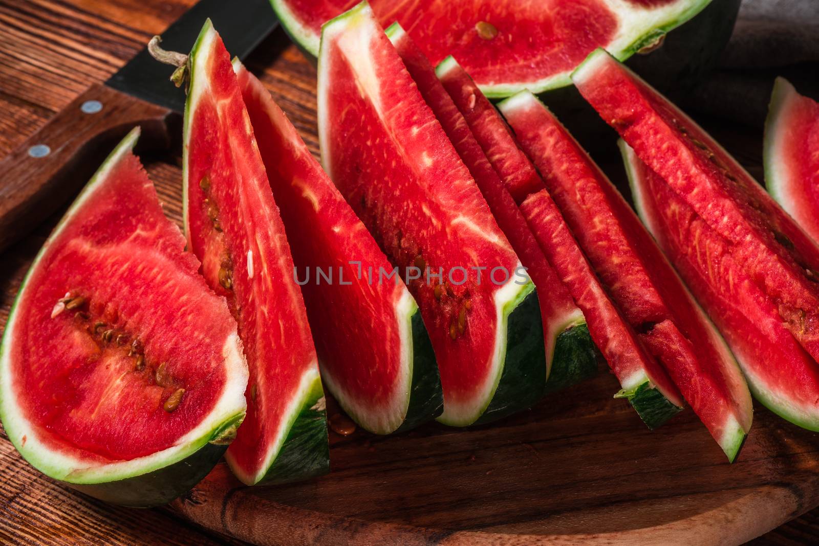 Slices of ripe and tasty watermelon lying on the board