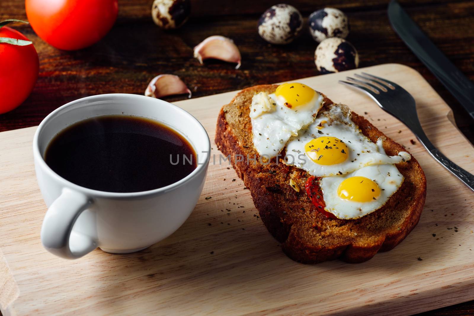 Breakfast with Cup of Coffee and Toast with Fried Eggs and Tomatoes
