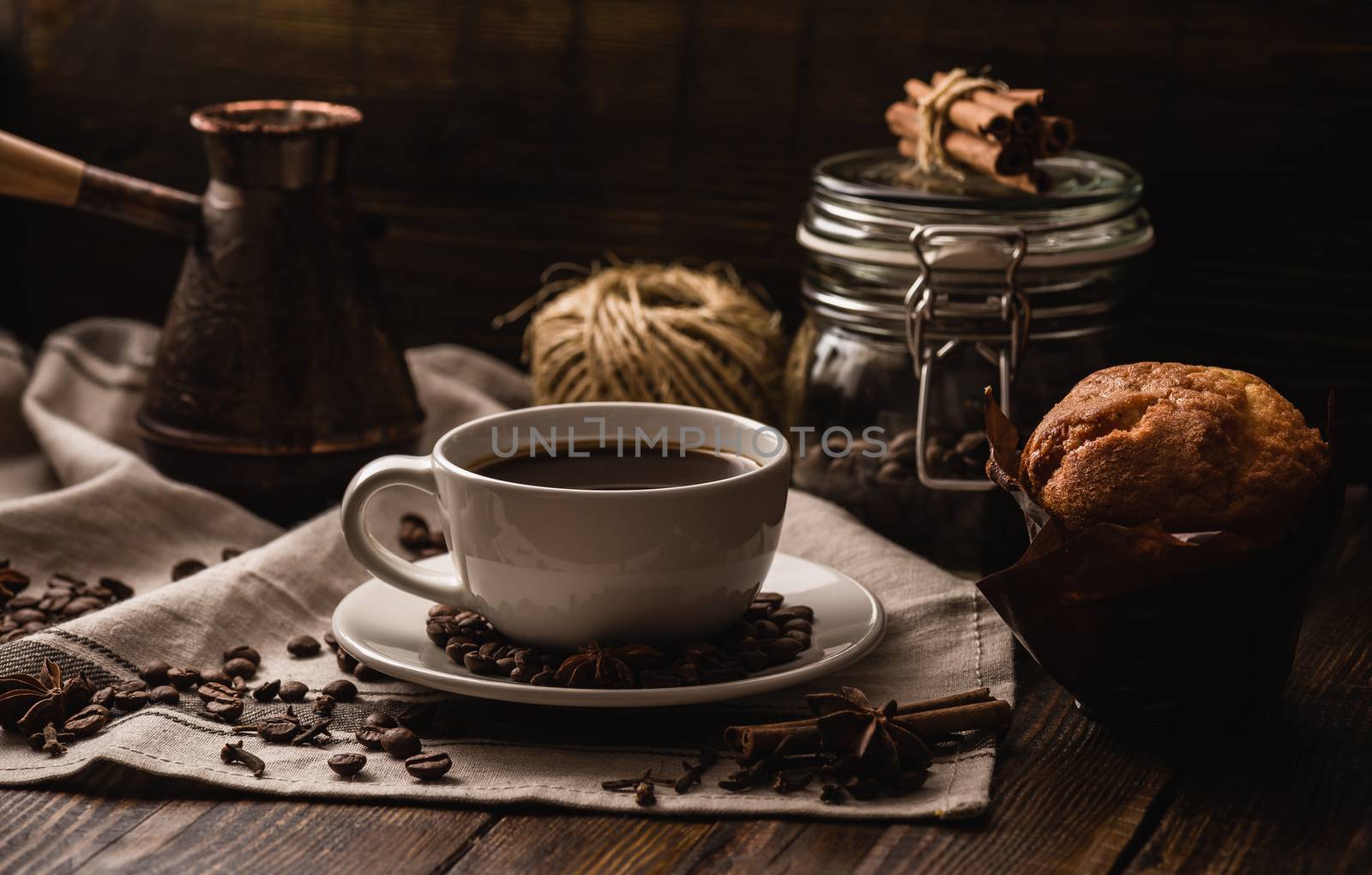 Cup of Coffee with Muffin, Different Spices and Some Kitchen Equipment