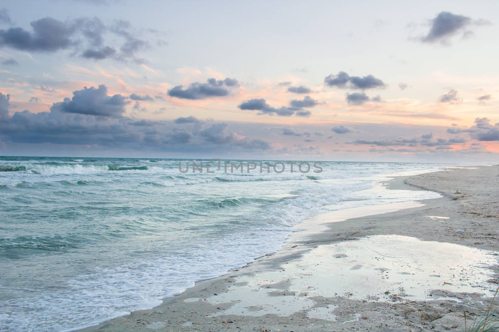 Empty sea coast beach landscape with sunrise cloudy sky by VeraVerano