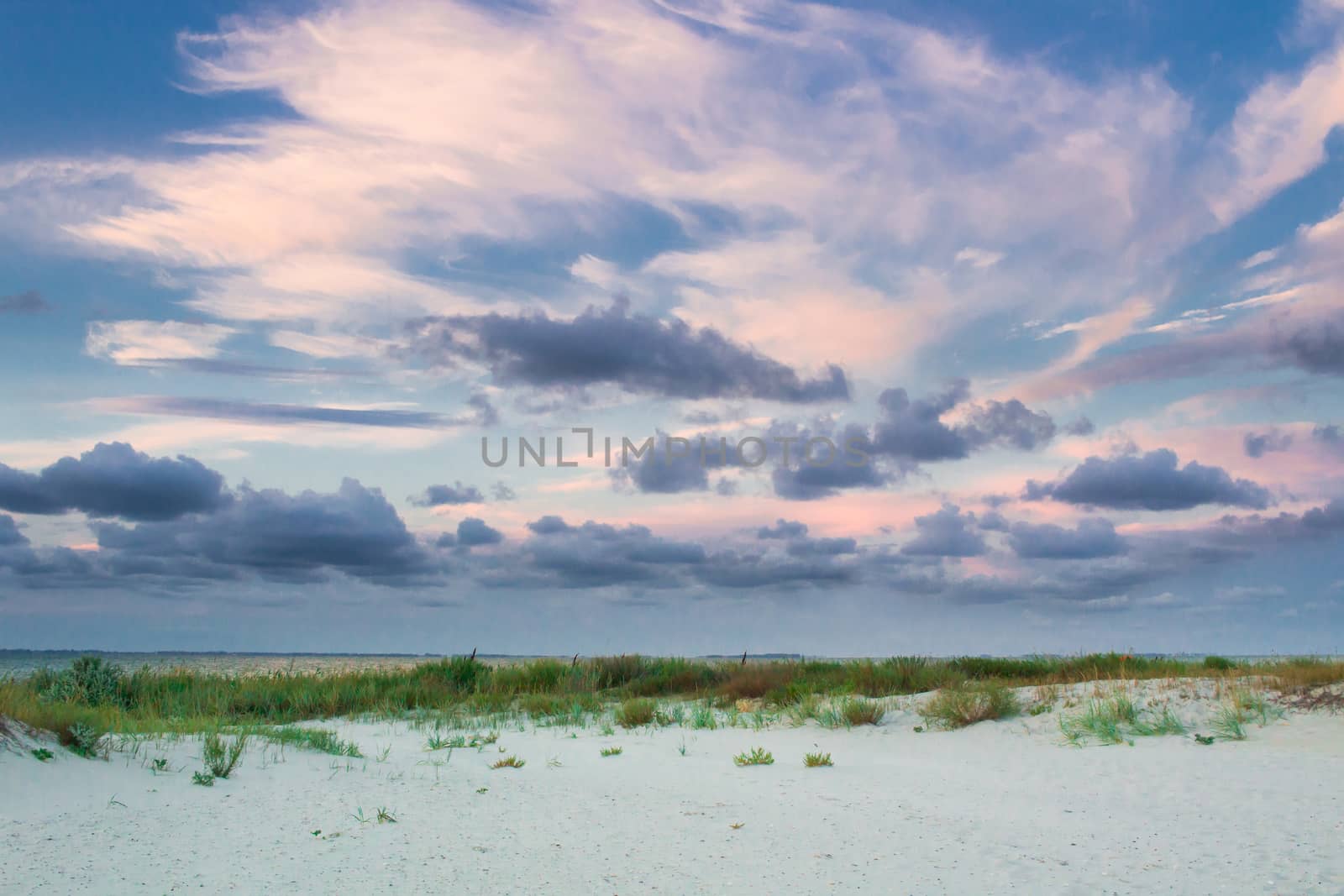Empty sea coast beach view with sunrise cloudy sky by VeraVerano