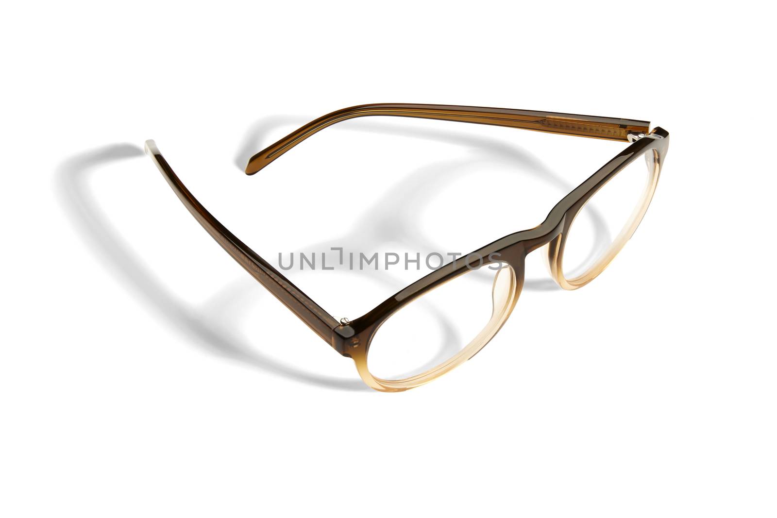 Studio shot of pair of eyeglasses on white background with shadow.