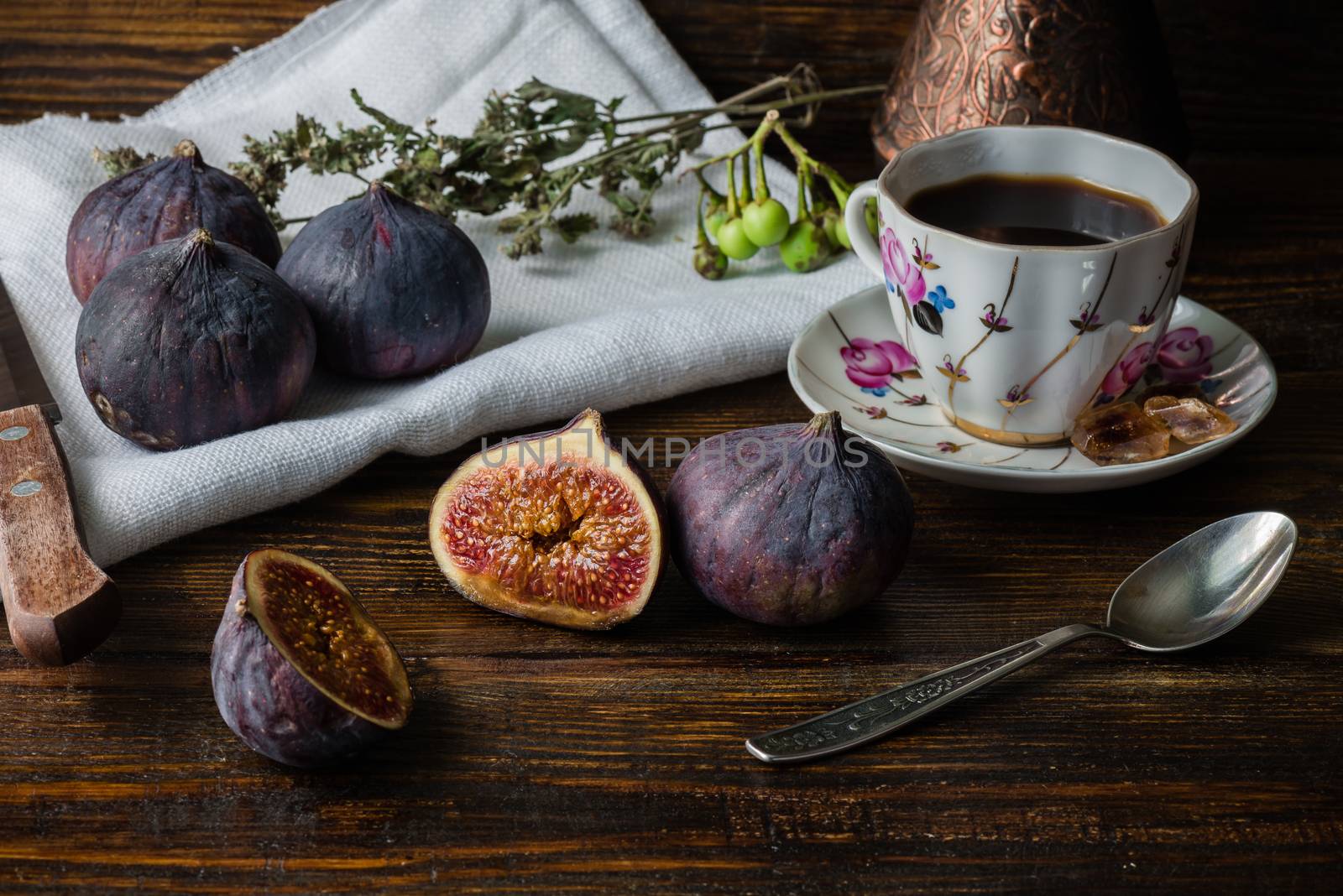Cup of coffee with juicy figs for tasty dessert