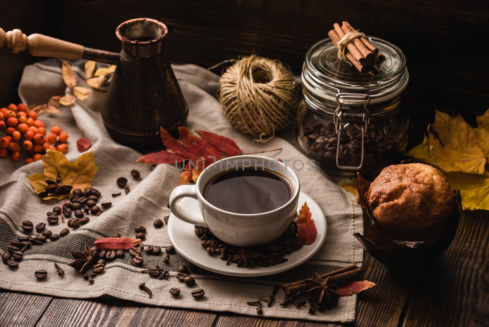 Autumn Leaves with Cup of Coffee and Muffin, Ingredients, Spices and Some Kitchenware on tablecloth.