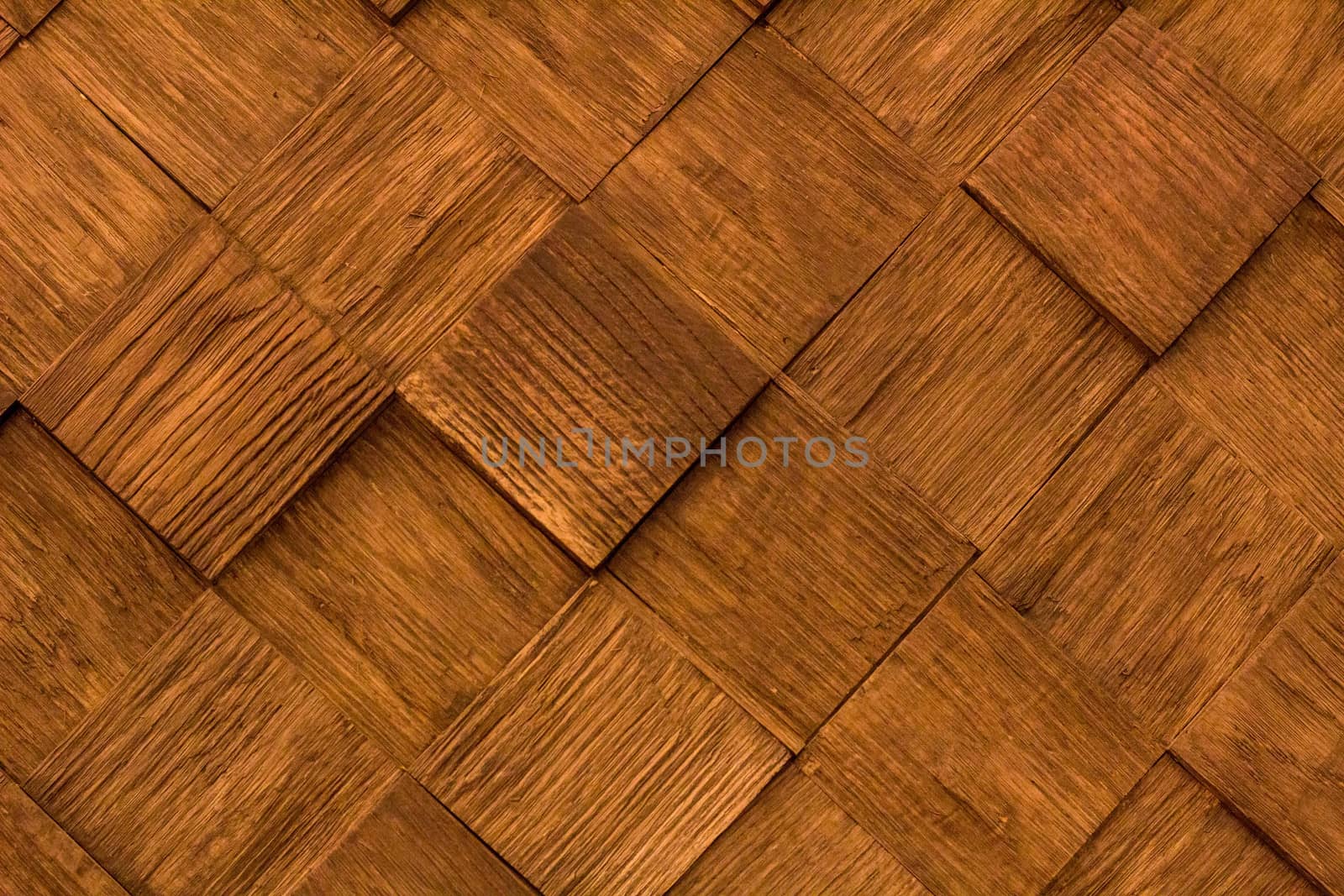 Natural wooden diagonal background pattern of golden brown quadrate pieces