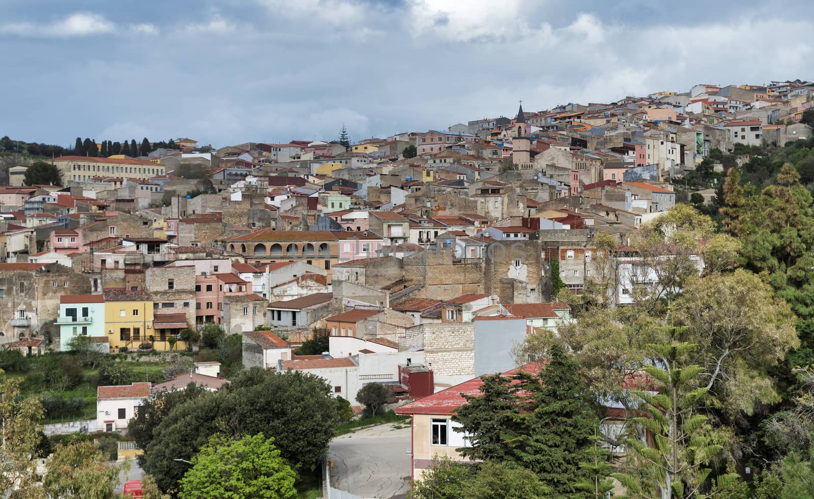 skyline with old houses of the village Sennori seen from the upper promenade on  Sardinia, Italiy